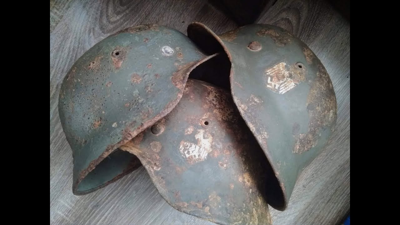 Restoration of a military artifact.  Three German helmets.
