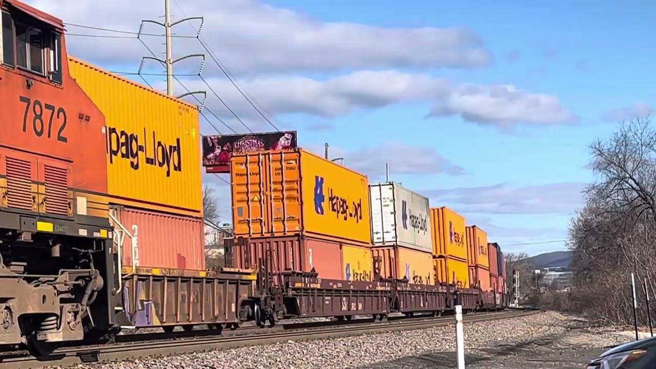 NS Intermodal Rolls Past a Stopped NS Intermodal With a BNSF ES44DC Soloing It