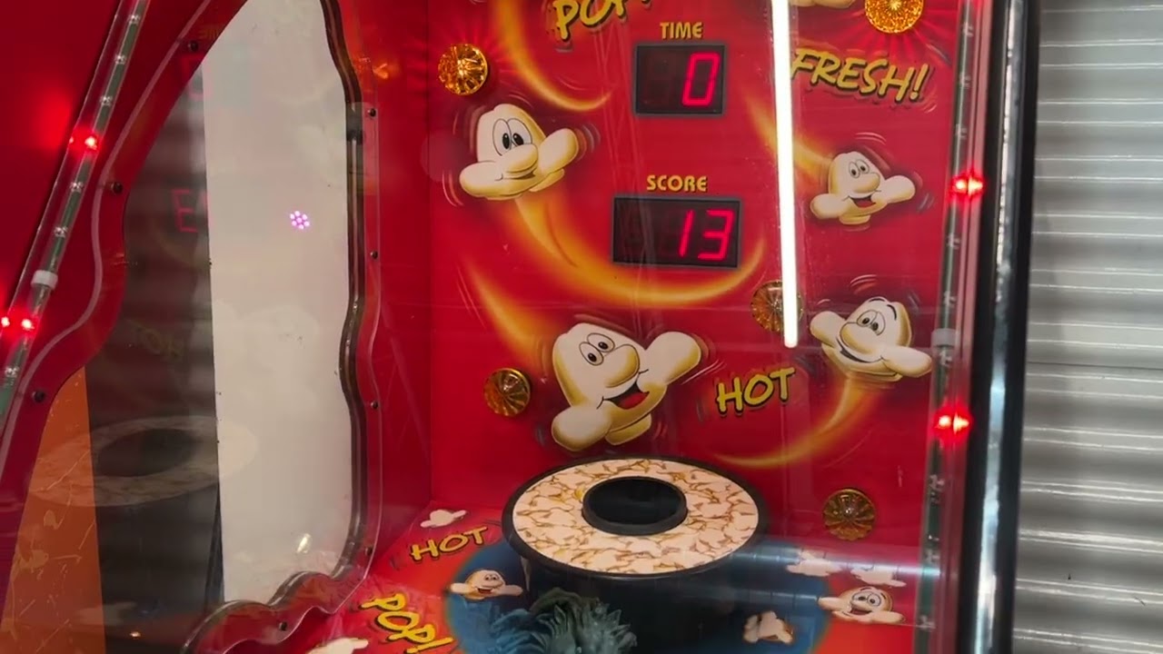 Nate and Beth playing Popcorn at an arcade