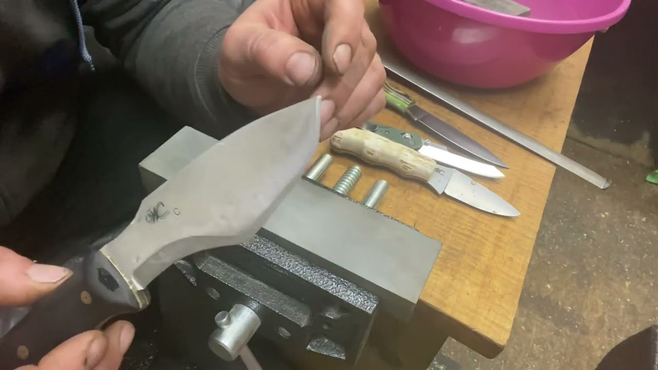 Stone sharpening on woodsman’s grind