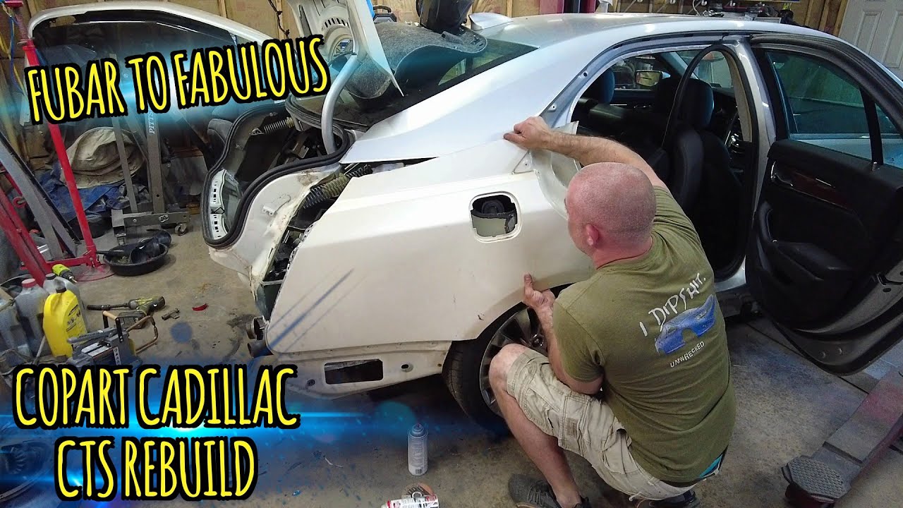 Finally mounting the used quarter panel on my Copart Cadillac CTS