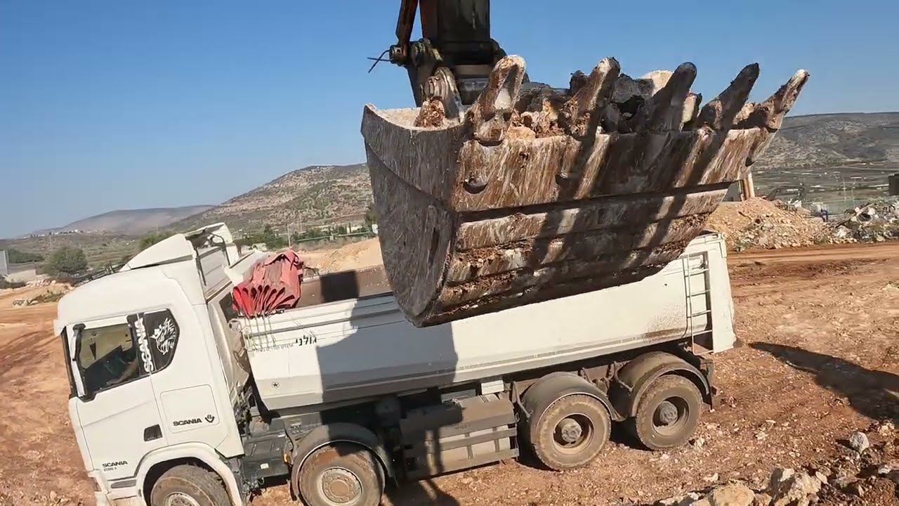 Hitachi 350 Excavator Loading Rocks into a Truck with Stunning Sound!