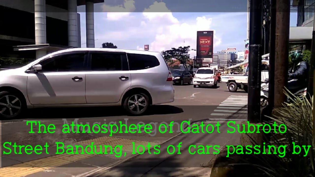 The atmosphere of Gatot Subroto Street Bandung during the day, lots of cars passing by.