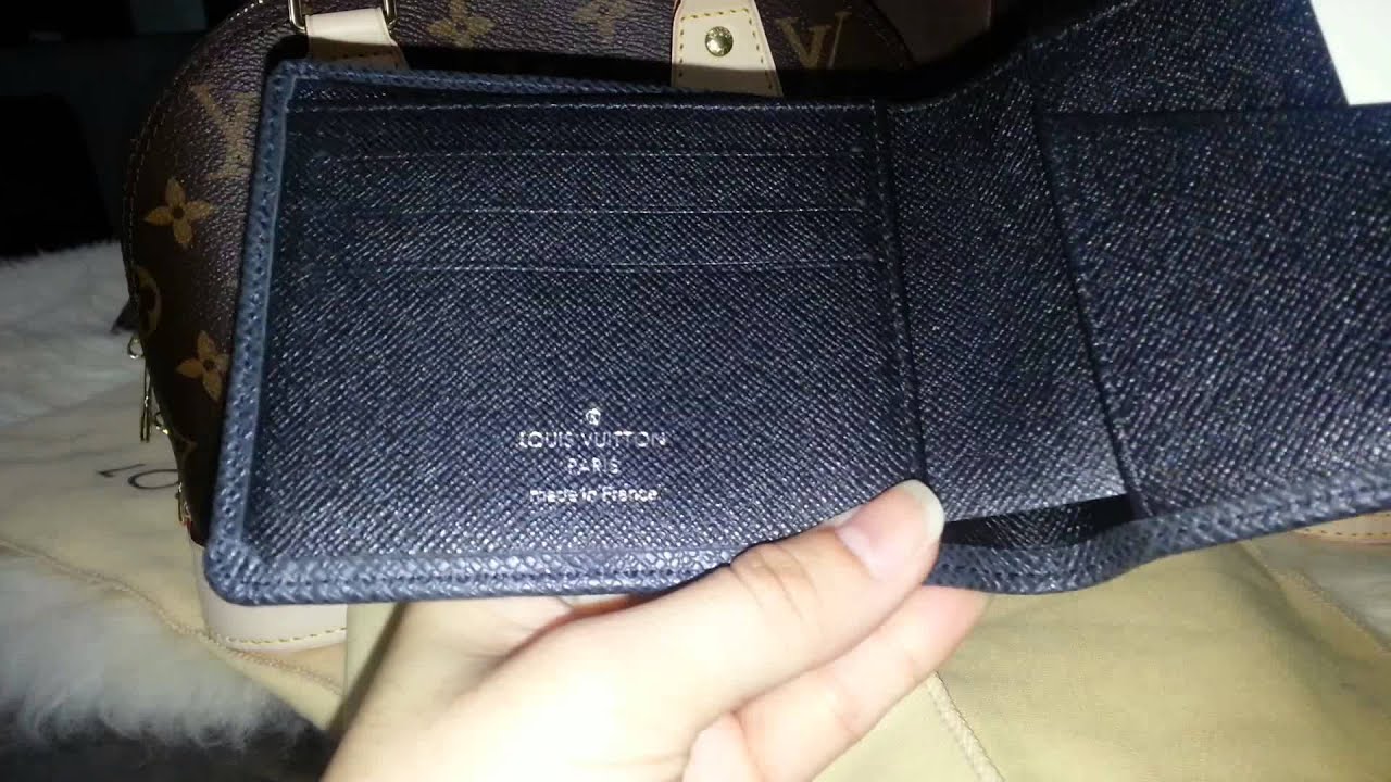 Lv man wallet M30952 Taiga- sold