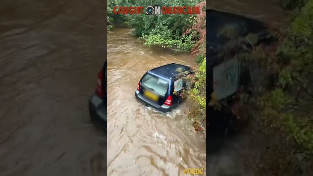 Car Floats Down Flooded Road!