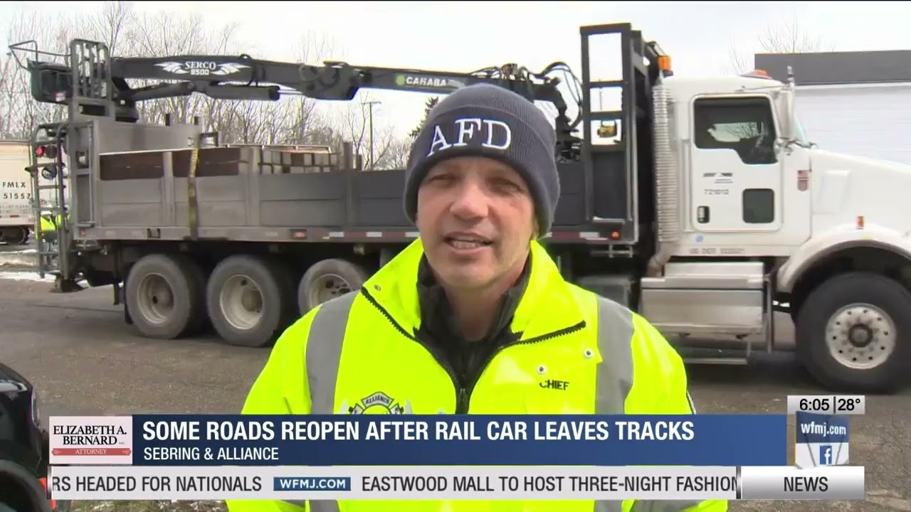 Some roads reopen after rail car leaves tracks