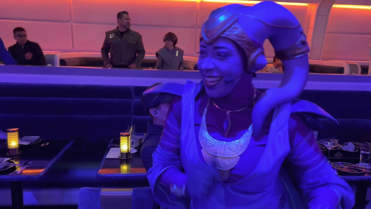 Star Wars Halcyon Galactic Starcruiser  - Gaya singing final song in dining room - storm troupers
