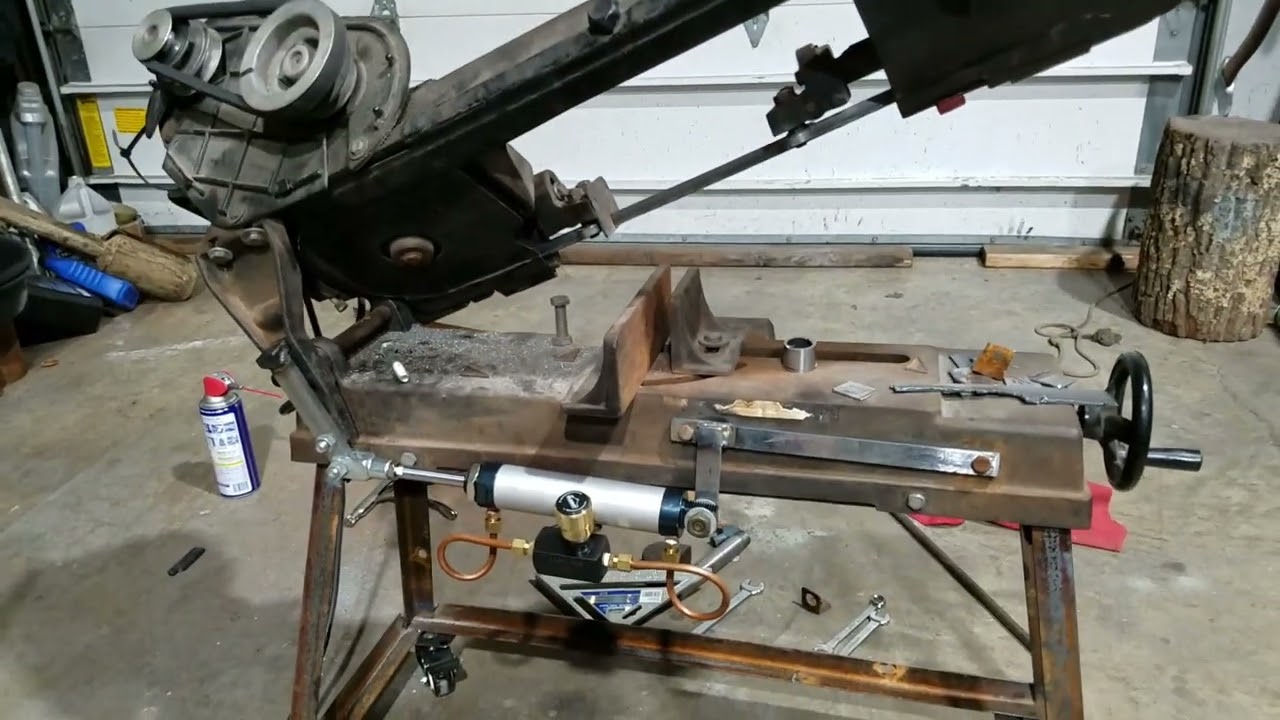 Cheap DIY hydraulic downfeed for 4x6 metal bandsaw