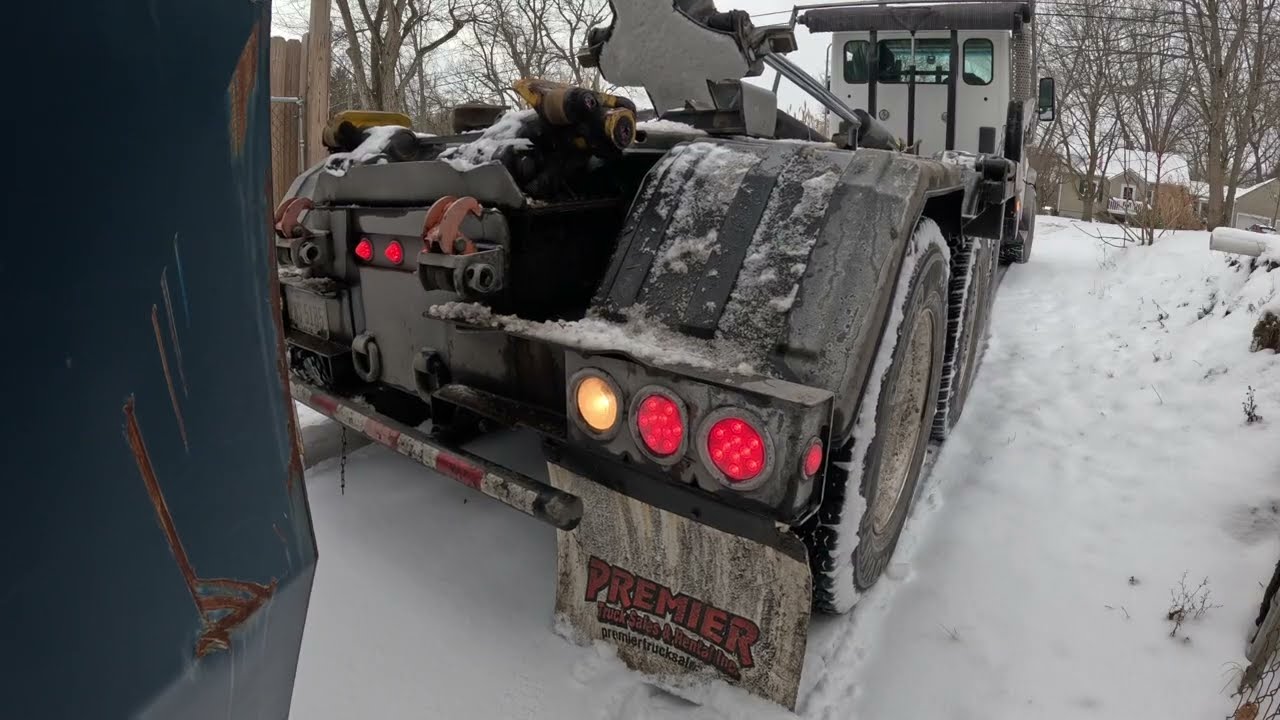 Dropping a box in snow covered drive