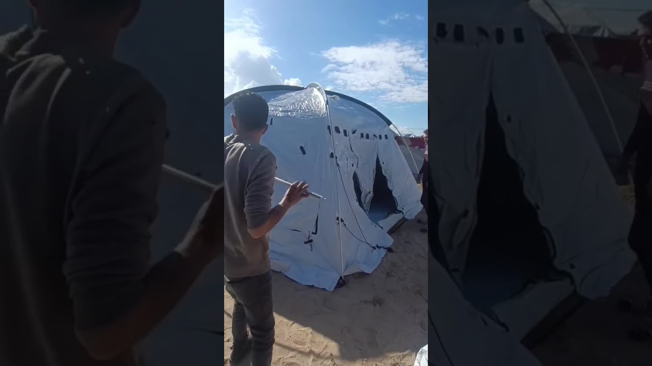 Tent number 26 being set up for a displaced family in G4za 