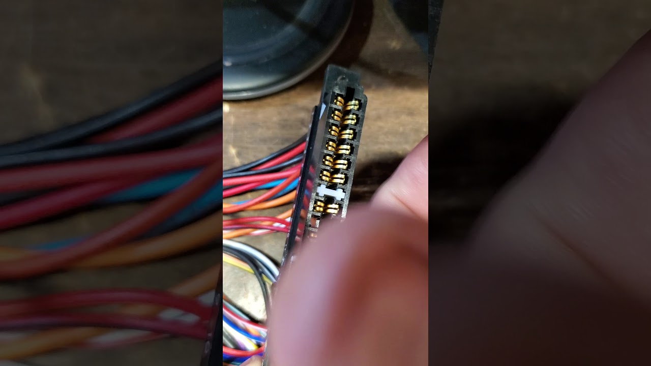 Removing pins from a JAMMA harness