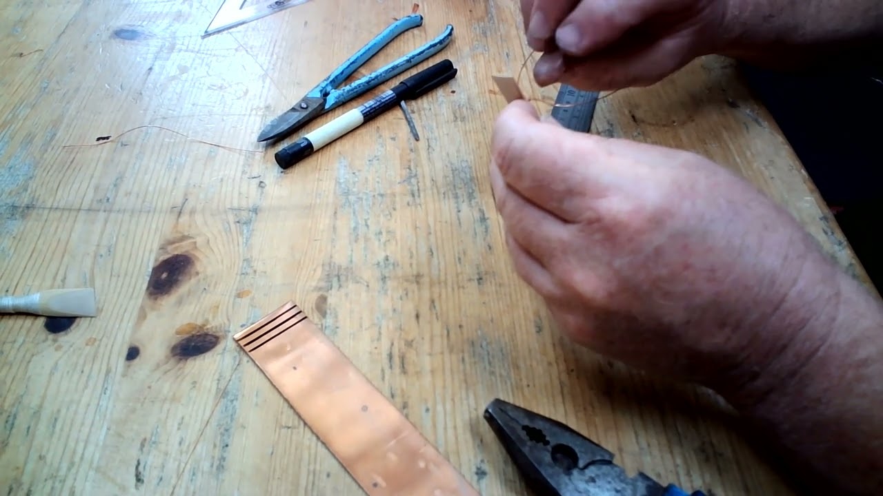 Cillian Ó'Briain fitting wire Bridle to uilleann pipe reeds