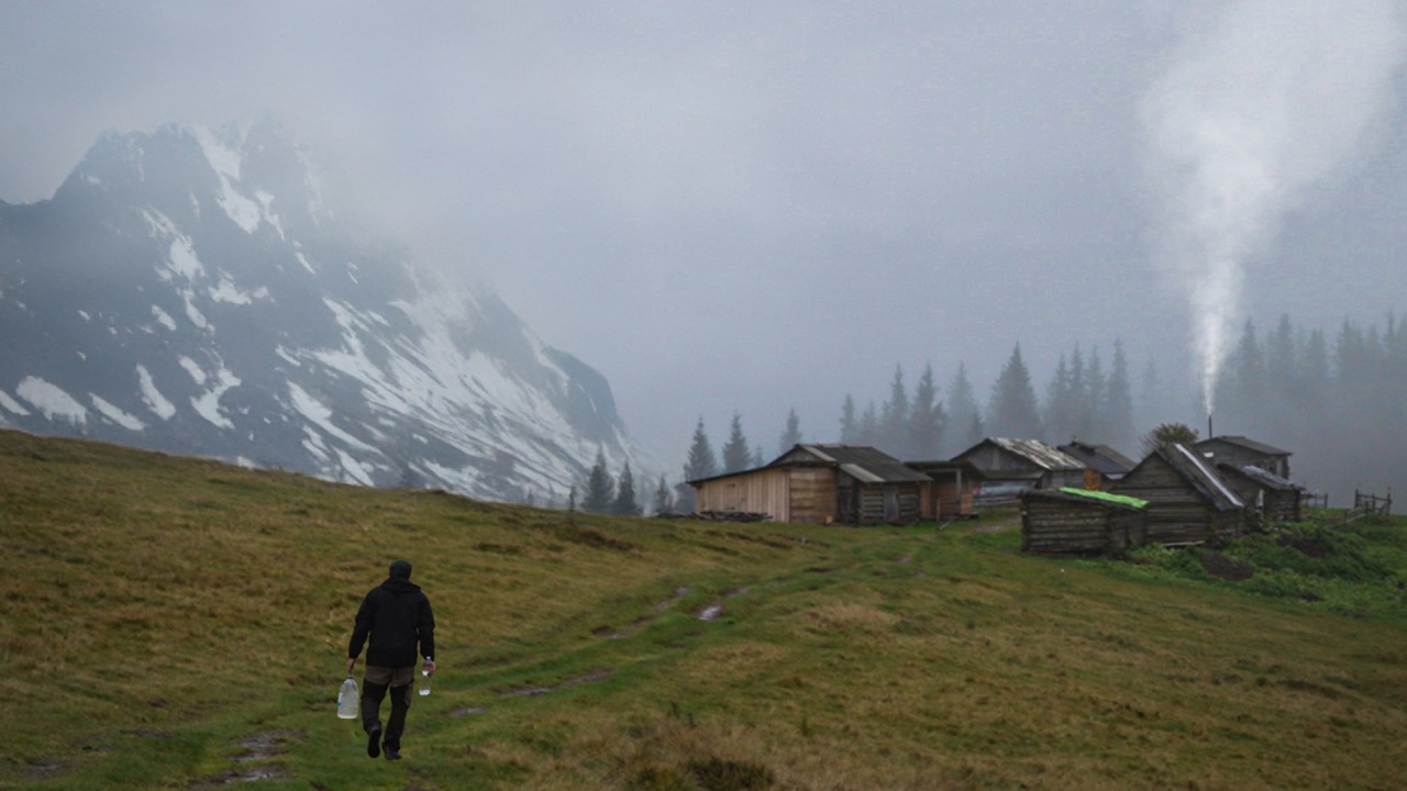 Abandoned shelter in the mountains, a night in a rustic log cabin with a stove