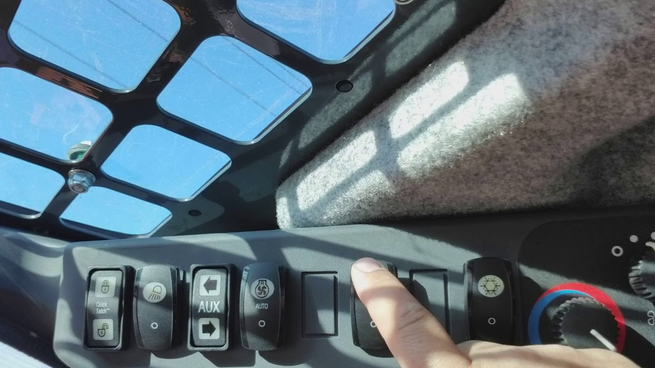 How to operate a John Deere 333G with a mulcher head attachment.