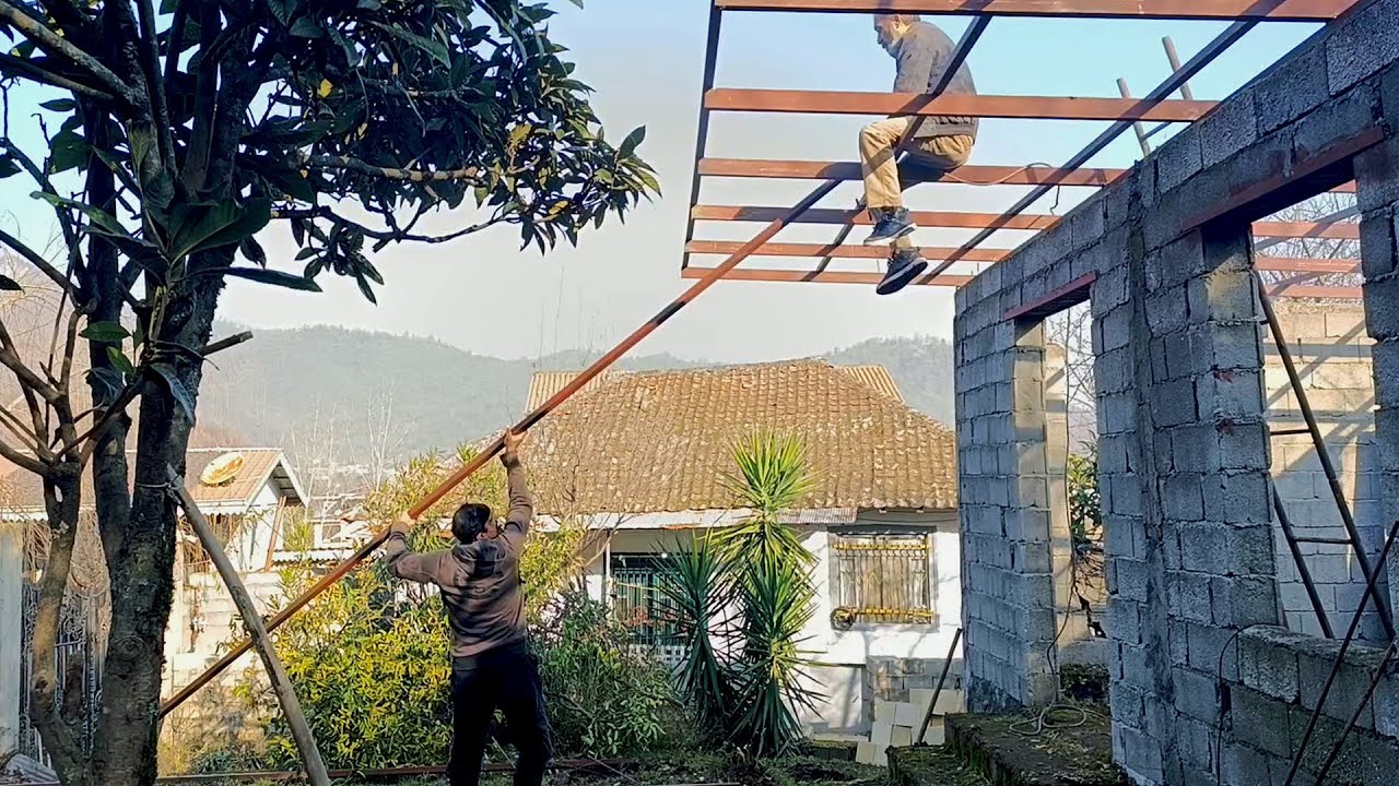 Real Rural Life: Men Welding the Roof of a Simple Village Home