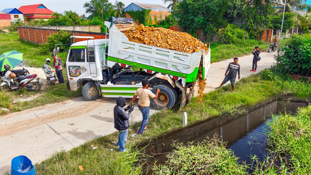 Massive Flooded Landfill Transformed ! Dump Truck Unloading soil With Bulldozer