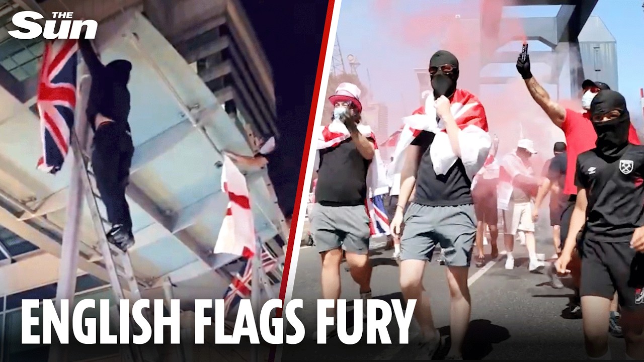 Masked men hang English FLAGS in Canary Wharf as 'woke' row continues