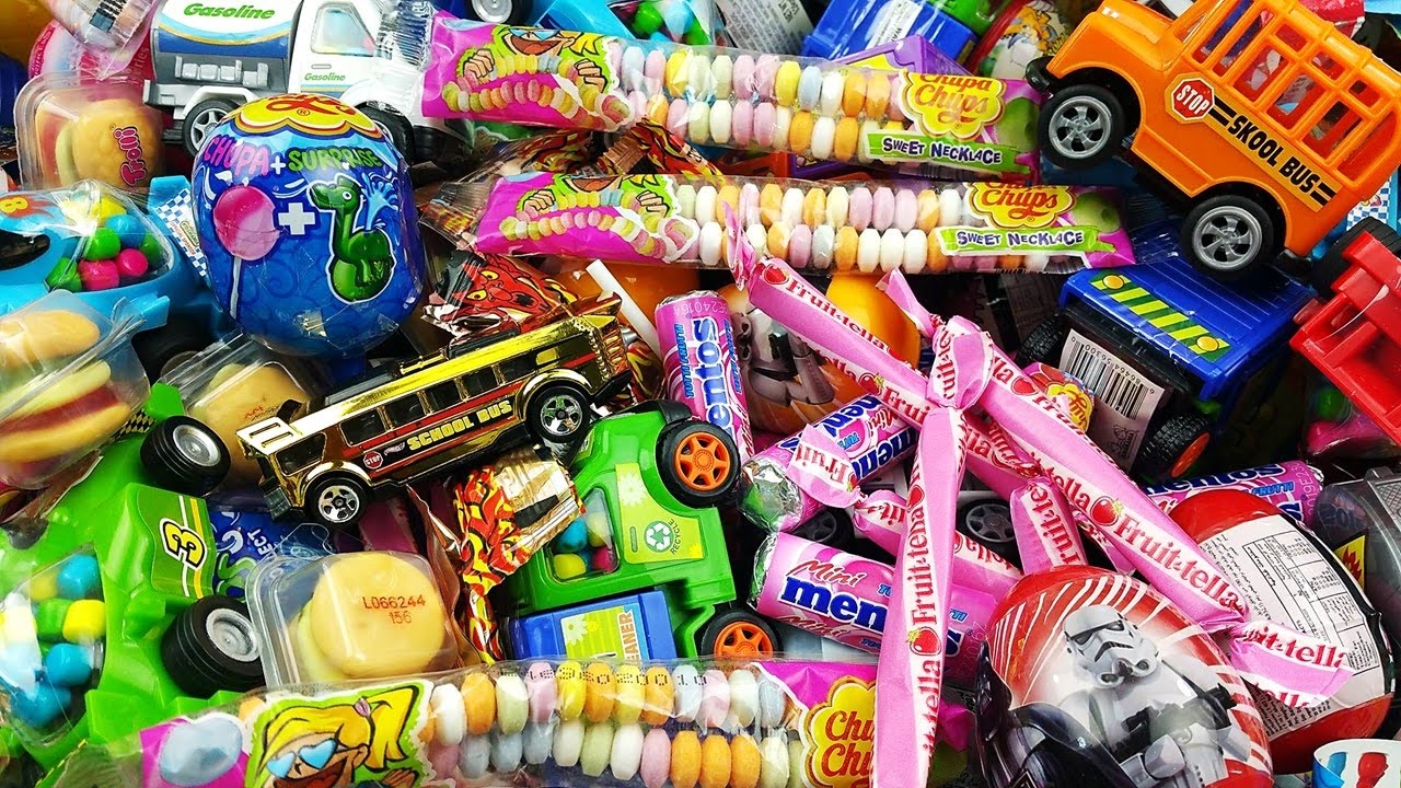 The Wheels On The Bus Go Round and Round - A lot of Candy & Surprise Eggs Learn Colors