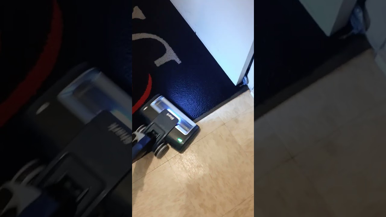 Vacuuming the front door rugs