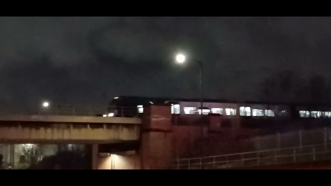 Class 195 passing a railway bridge at 30MPH