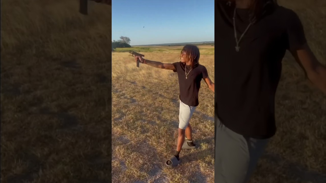 Teaching thug how to shoot gun