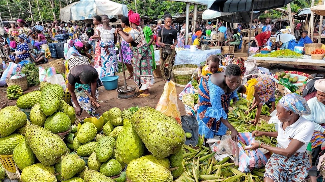 Rural village market day in Assahoun Togo west Africa. Fresh organic food market.