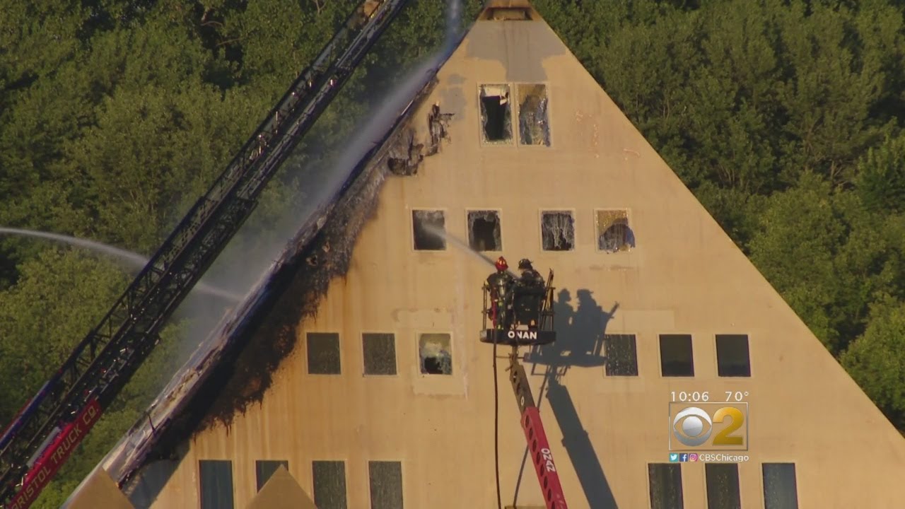 Firefighters Battle Flames At Gold Pyramid House