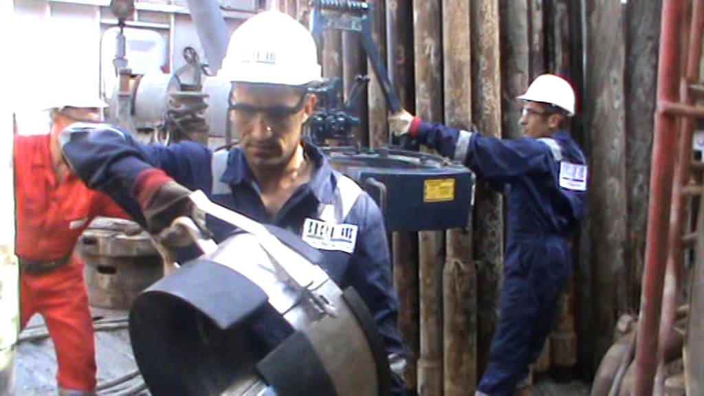 Power Tong Guys Running Casing Tool on the Oil & Gas Drilling Rig - Part 07