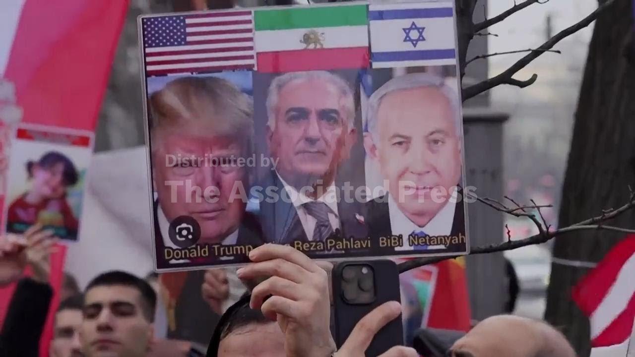 Members of the Iranian community attend a rally in Bucharest in the wake of deadly protests in Iran