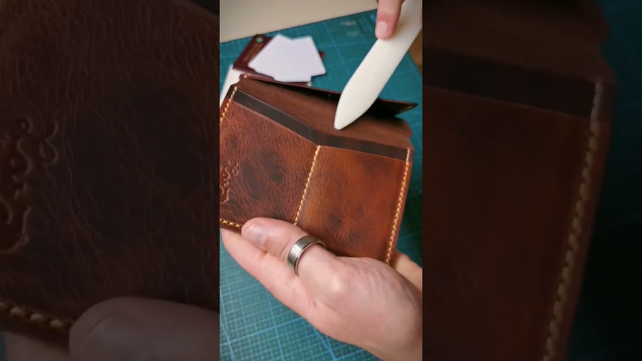 My bone folder used to remove the glue near the stitch lines, and break in the leather.