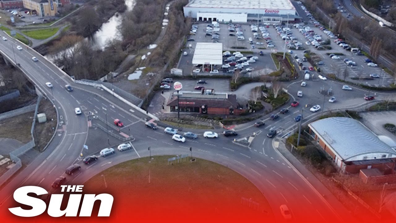 Motorists queue at UK petrol stations as fears prices will rise following Russia's attack on Ukraine