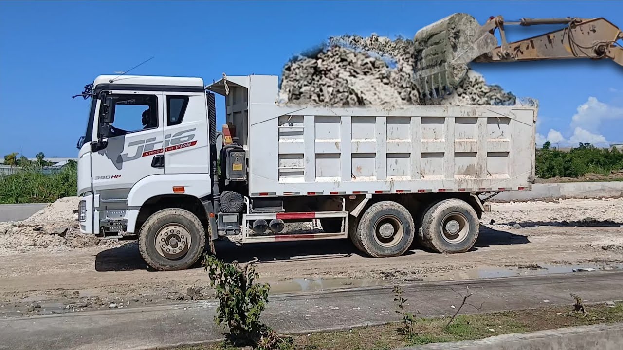 Strong & versatile Chinese FAW truck moving TONS of marl from one place to another 