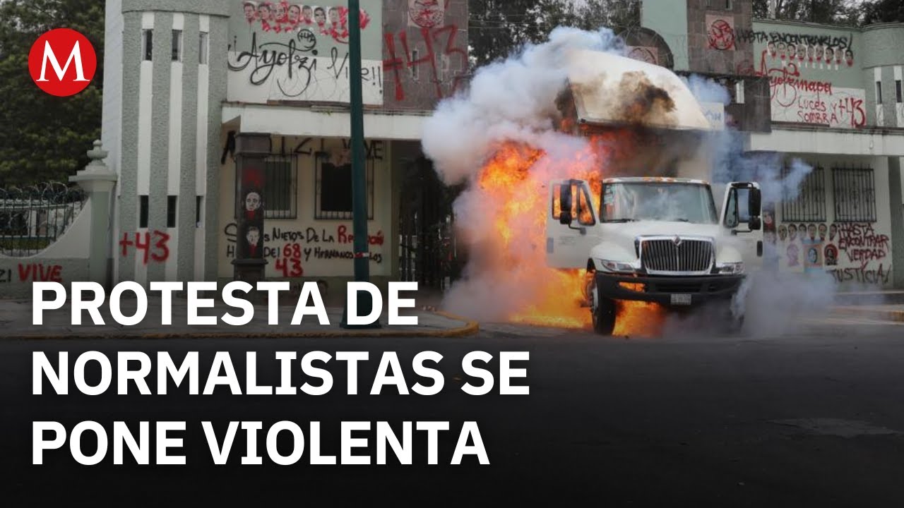 Caso Ayotzinapa: Derriban puerta, lanzan petardos y queman cami&oacute;n en Campo Militar 1