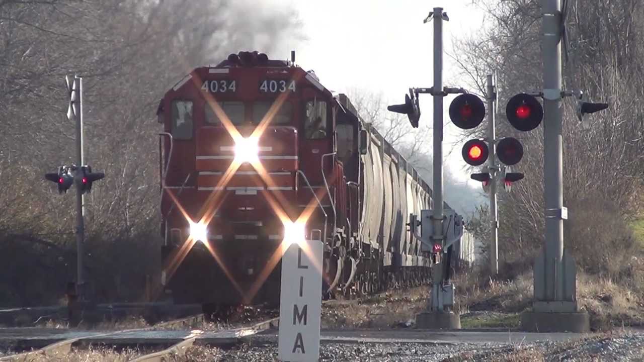 CF&E Railroad  IORY 4034 RS5T creeps across the CSX diamond