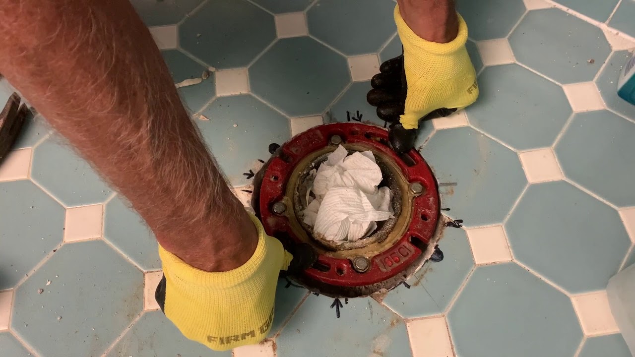 How install a cast Iron toilet flange in a concrete floor to a cast iron sewer drain pipe