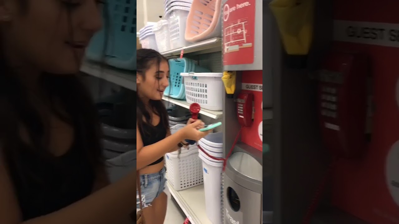 Girl plays music over speaker in Target