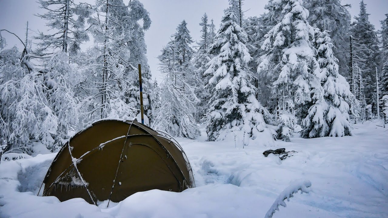 Caught in heavy snow high up in the mountains - winter solo camping in hot tent