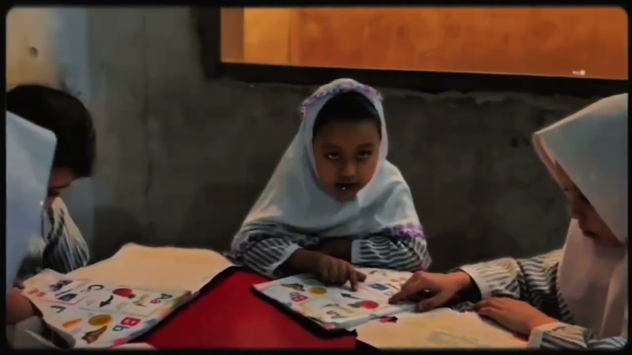 Students of Kindergarten busy in reading activity 2025-26 Batch