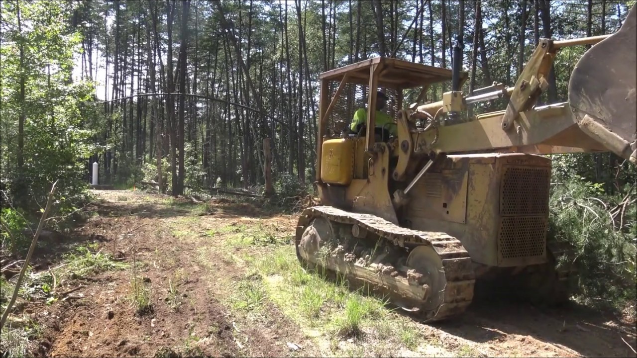 Clearing Road Through Woods with Cat 941