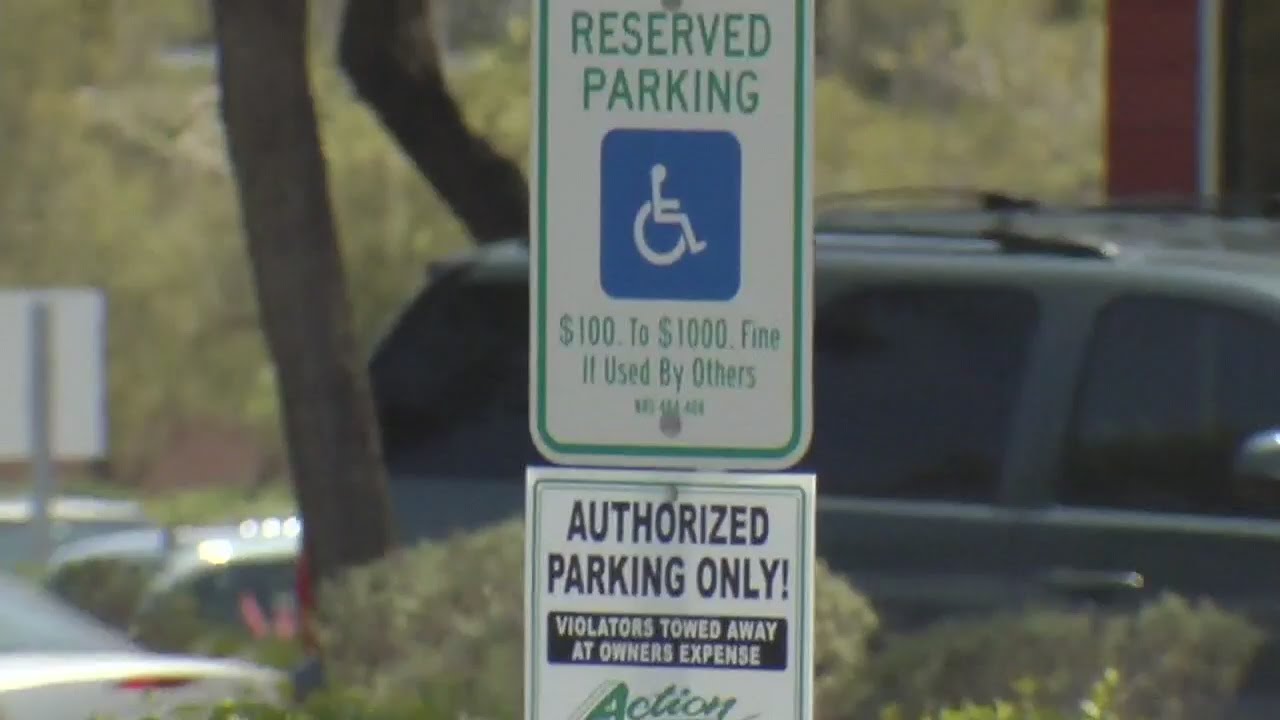 Towing sign next to handicap placard raises concerns