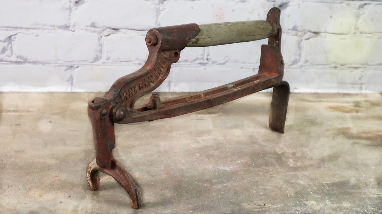 Restoring a Brikarier. Old and rusty tool used to carry a load of bricks.