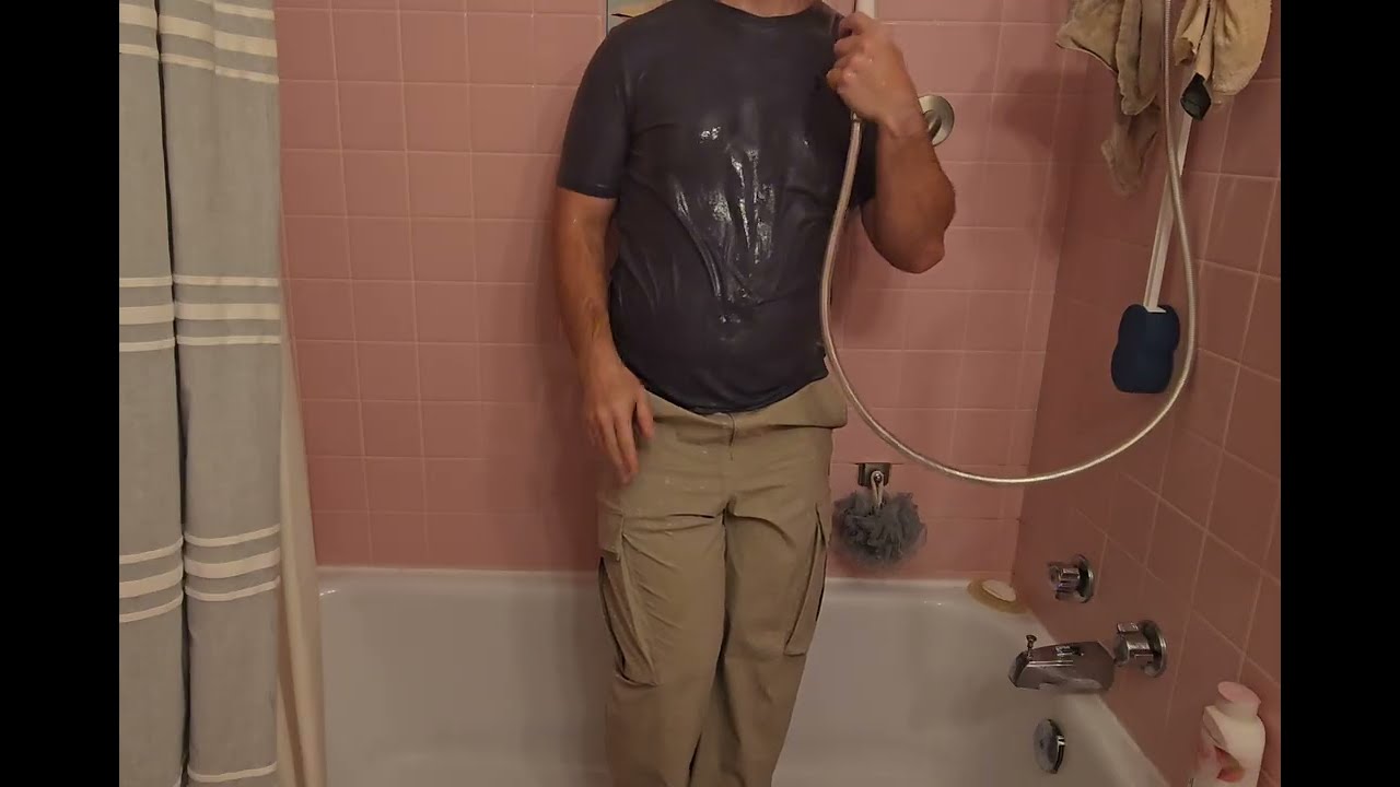 Shower in Under Armour clothes 