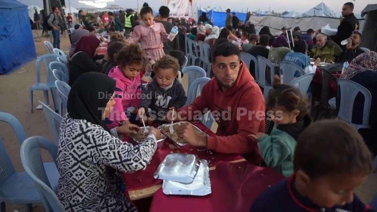 Displaced Palestinians in Gaza and orphans in Beirut gather for iftar during Ramadan