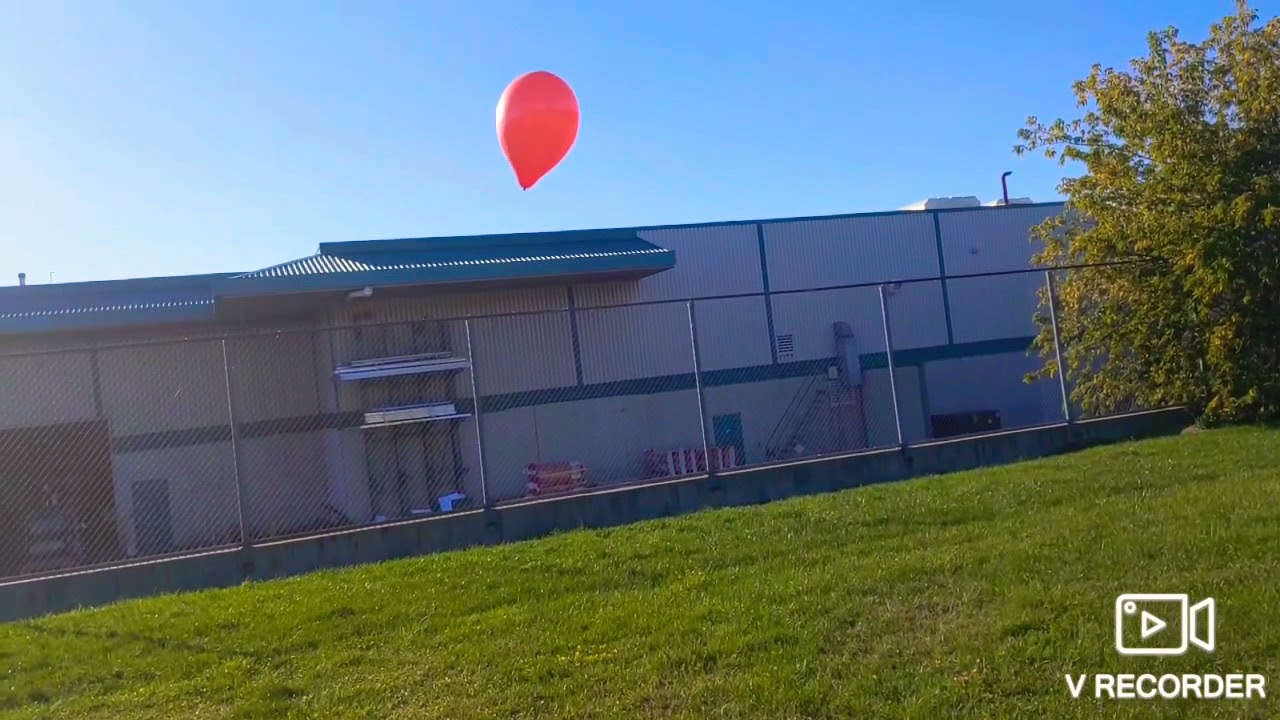 Balloons vs grass in Slow motion