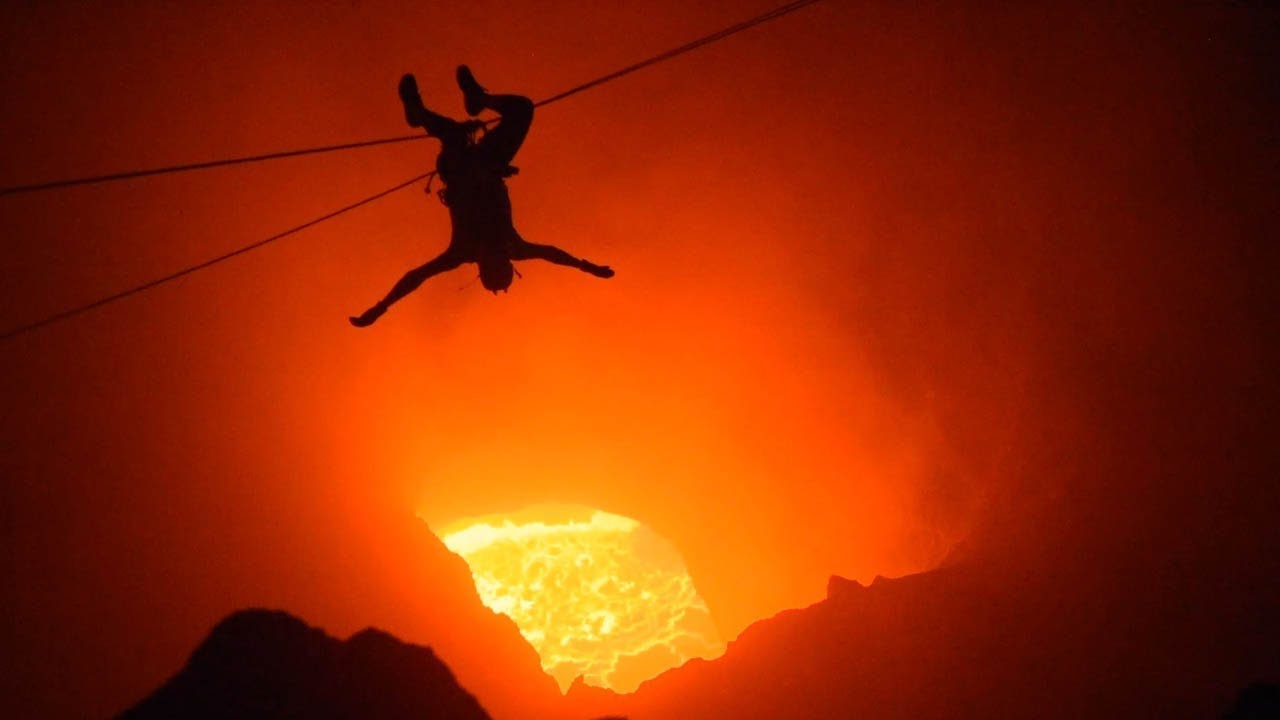 Thrill-Seekers Zipline Over Active Volcano