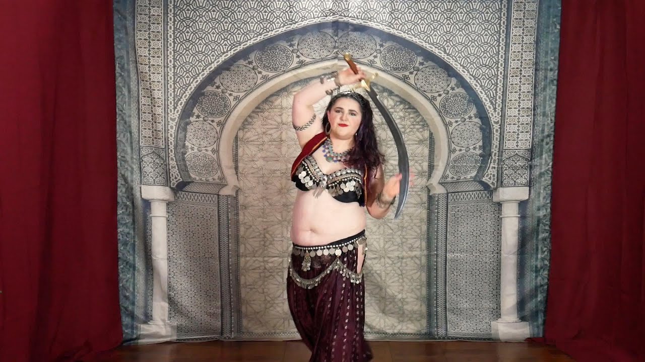 Bonnie Belle - Belly Dance with Sword to Serpentine by Mosavo