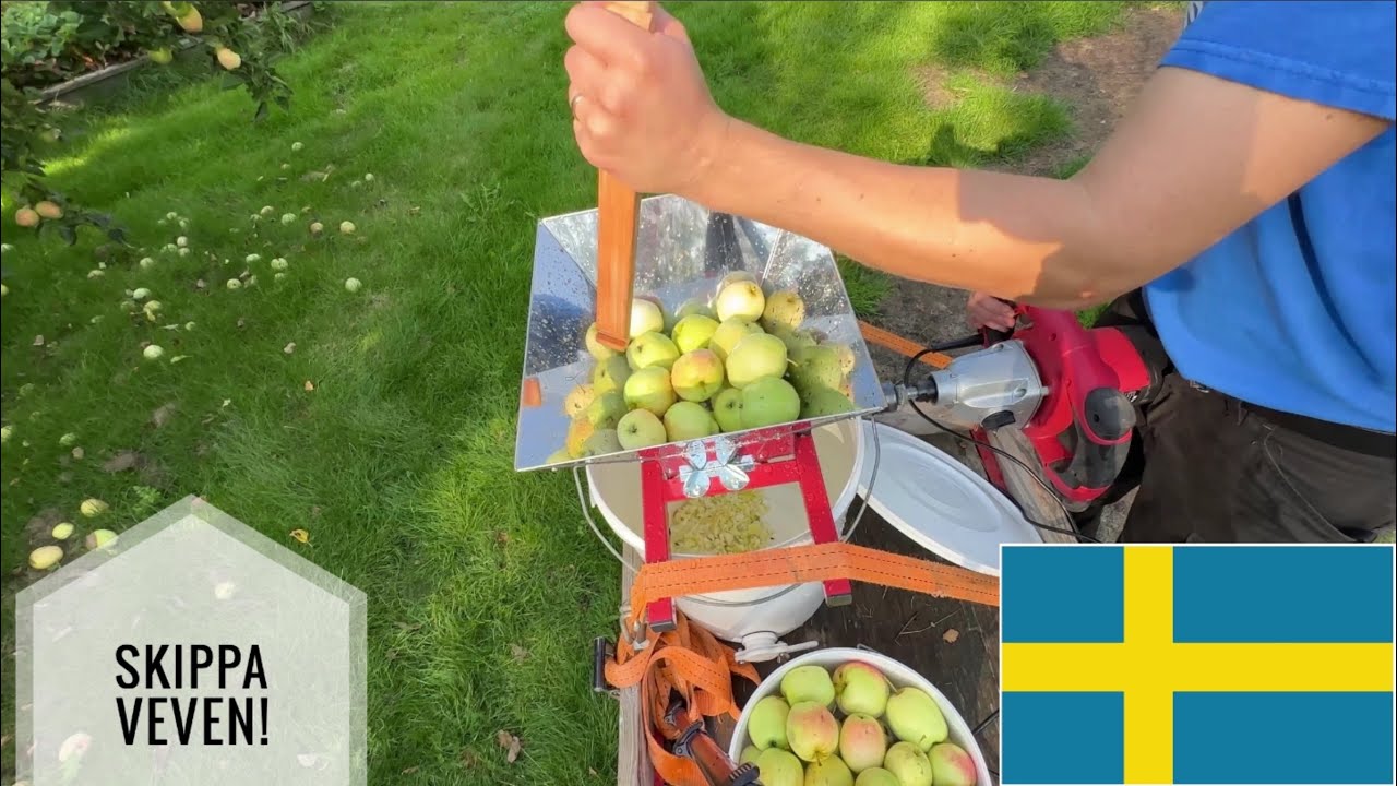 Monterar elmotor på äppelkrossen