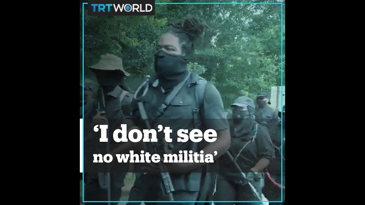 A group of armed protesters march in Georgia, US