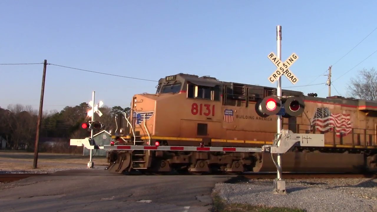 UP 8131, 6313, and NS 4885 lead NS 64Q at the Long Station Road Railroad Crossing in Aragon, GA