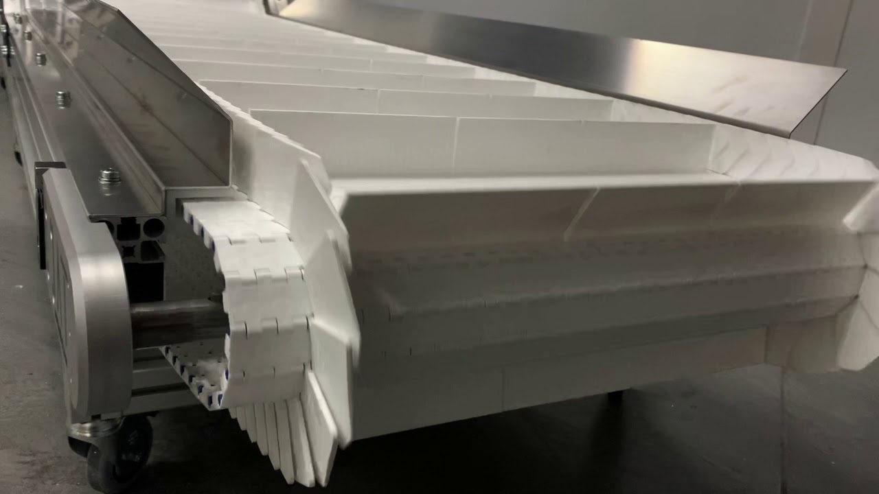 CINTA TRANSPORTADORA  DE BANDA MODULAR CON ELEVACIÓN